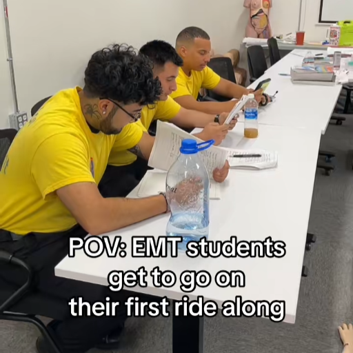 3 EMT students studying at a table
